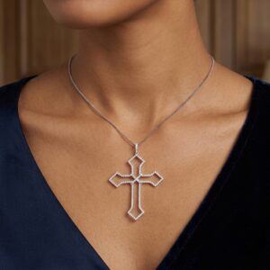 woman wearing 18ct white gold cross pendant